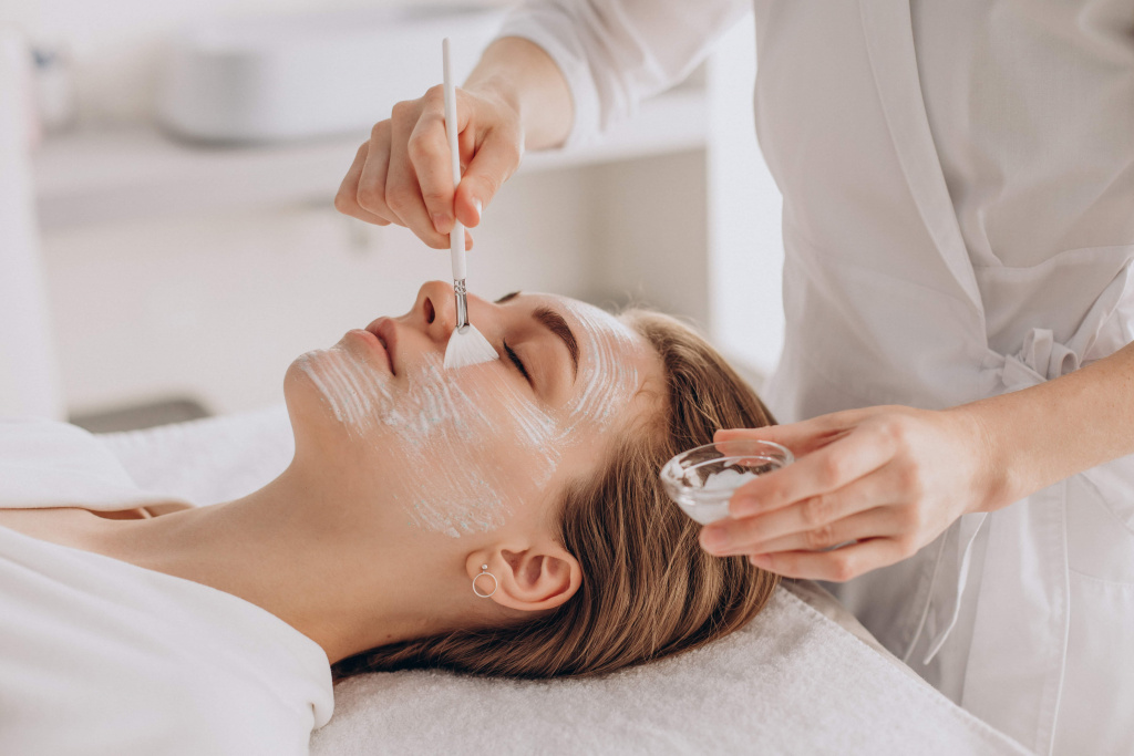cosmetologist-doing-face-treatment-applying-face-mask (1).jpg